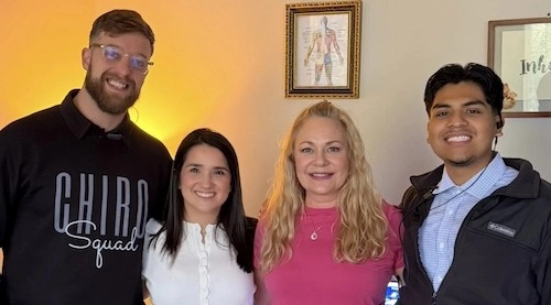 Dr. Nicole Shutko with her chiropractic team in Houston, TX